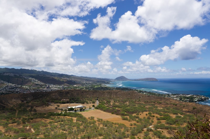 a scenic view of the ocean from a hill